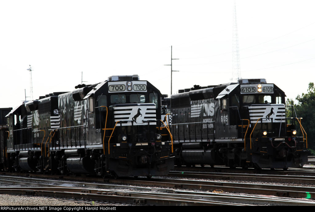 NS 6105 leads train E25 past the yard power
